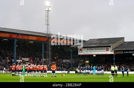 Nottingham Forest players stand for a minute's silence in memory of