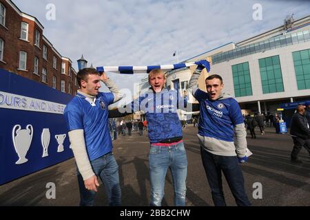 Chelsea's fans pose for a photo outside the stadium prior to the beginning of the match Stock Photo