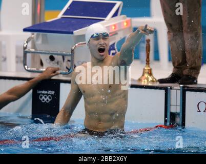 China's Sun Yang celebrates winning the Men's 1500m Freestyle Final at The Aquatic Centre Stock Photo