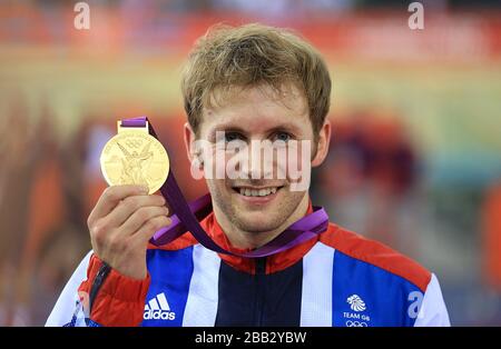 Great Britain's Jason Kenny celebrates with his gold medal after winning the Men's Sprint Final on day Ten of the Olympic Games at the Velodrome in London. Stock Photo