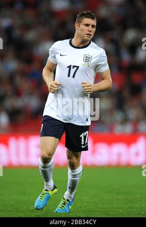 England's James Milner in action against Moldova. Stock Photo