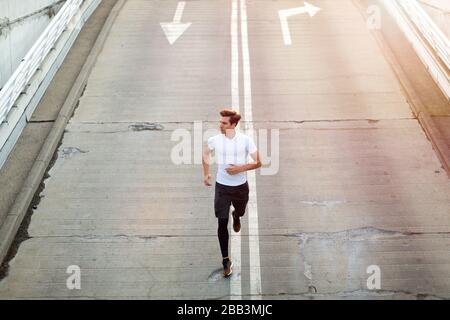 Young man exercising outdoors Stock Photo