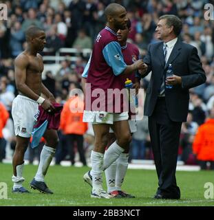 LONDON, United Kingdom, MAY 03 Frederic Kanoute of West Ham United shanks hands with Sir Trevor Brooking after Barclaycard Premiership between West Ha Stock Photo