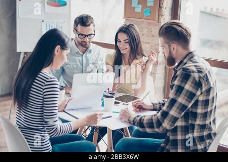 Self development seminar training of young business people in modern work station. They are start up partners, working on new concept Stock Photo
