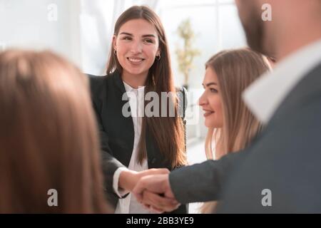close up. business woman shaking hands with her colleague. Stock Photo