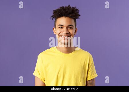 Close-up portrait of smiling, enthusiastic hispanic male student searching job, consider career opportunities, recruiting to company, smiling cheerful Stock Photo