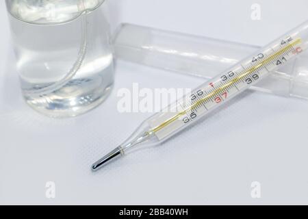 Thermometer macro, mercury instrument, measuring, indicating temperature medical equipment tool on white background Stock Photo