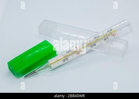 Thermometer macro, mercury instrument, measuring, indicating temperature medical equipment tool on white background Stock Photo