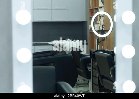Beauty salon with barber equipment in mirror Stock Photo