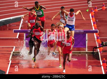 Competitors go over the water jump during Round 1 of the Men's 3000m Steeplechase Stock Photo