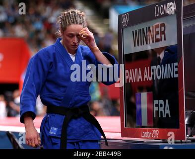 Great Britain's Sarah Clark after losing to France's Automne Pavia during their Women's 57kg Judo bout at the ExCel North Arena 2, London, on the third day of the London 2012 Olympics. Stock Photo