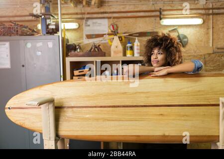 Afro american woman craftswoman working in her workshop Stock Photo