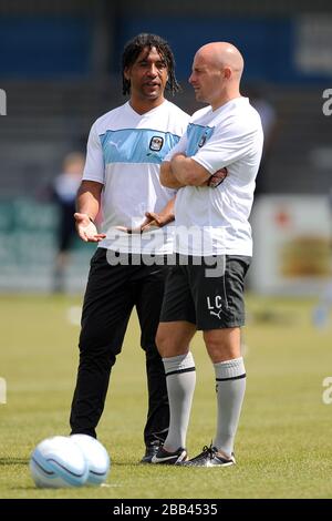 Coventry City coaches Richard Shaw and Lee Carsley (right) during the warm-up Stock Photo