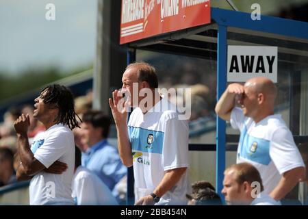 Coventry City coaches Richard Shaw, Steve Ogrizovic and Lee Carsley (right) on the touchline Stock Photo