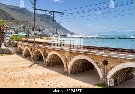 Cape Town, South Africa, 20th January - 2020: Train bridge over tidal beachfront. Stock Photo