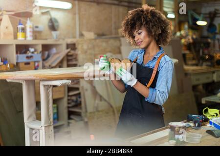 Afro american woman craftswoman working in her workshop Stock Photo