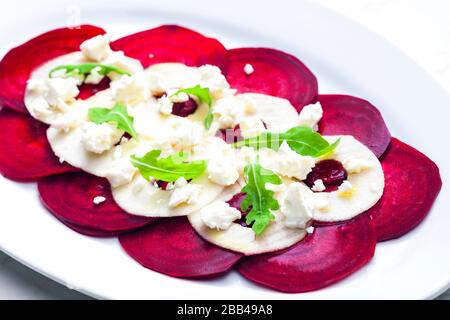 fresh beetroot and apple salad with fresh goat cheese and arugula Stock Photo