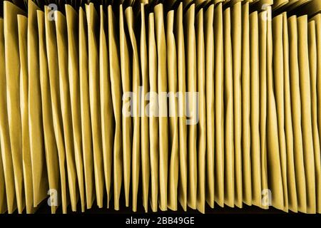 Stack of bubble envelopes inside a box. Close up, top view. Stock Photo