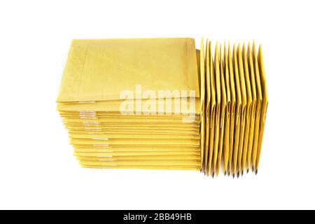 Two stacks of bubble padded envelopes isolated on white. Stock Photo