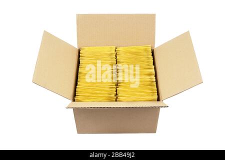 Lot of yellow bubble envelopes inside an opened cardboard box isolated on white. Stock Photo