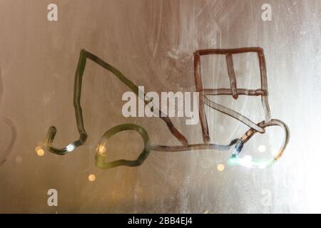 Tow truck finger drawing by child kid in condensation on window pane Stock Photo