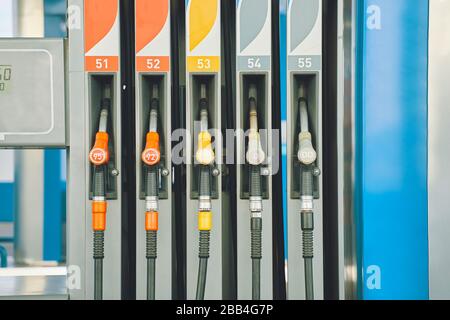 Gas station. Gas pump nozzles on the petrol station. Stock Photo