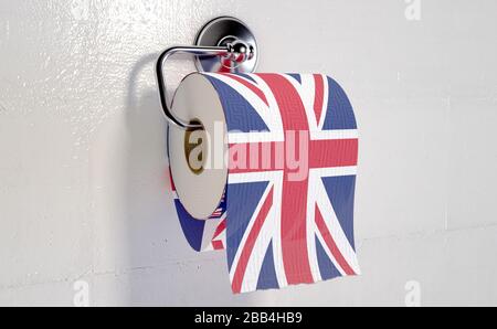 A roll of toilet paper with a print of the british flag hanging on a chrome toilet roll holder - 3D render Stock Photo