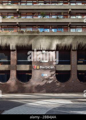 The Barbican, Silk Street, London EC2. The iconic Brutalist architecture and signage of the Barbican estate in the heart of the City of London. Stock Photo