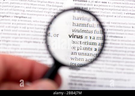 Page of Book with definition of word virus in dictionary Stock Photo