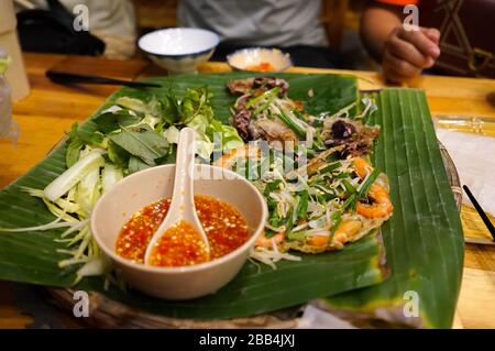 Quy nhon famous street food called jumping shrimps pancakes or Banh xeo tom nhay Stock Photo