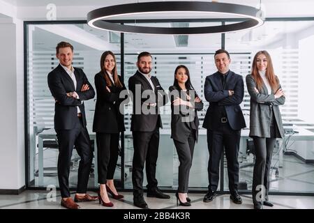 Confident team. Successful colleagues posing at camera Stock Photo