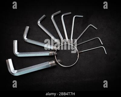 L-shaped hexagon wrench set on dark background. Stock Photo