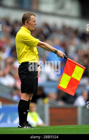 The assistant referee signals for an offside Stock Photo