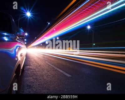 Tail Lights of a light rail at The Galata Bridge, Istanbul. There are nice reflections on the cars doors. Stock Photo