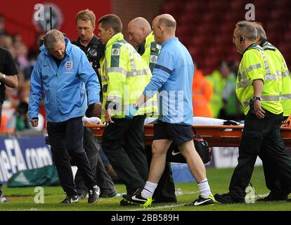 England manager Roy Hodgson checks on the welfare of Nathaniel Chalobah after he is stretchered off the pitch after picking up an injury Stock Photo