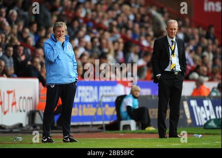 England manager Roy Hodgson (left) and Scotland Under 21 coach Billy Stark (right) on the touchline Stock Photo
