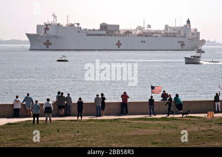 The U.S. Navy Military Sealift Command hospital ship USNS Comfort has a ceremonial departure from Naval Station Norfolk March 28, 2020 in Norfolk, Virginia. The Comfort is deploying to New York in support of the nation’s COVID-19 response efforts. Stock Photo