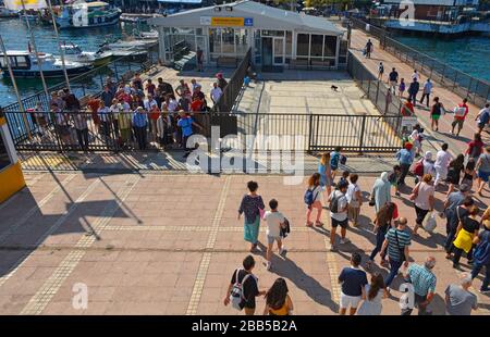Burgazada,Turkey-September 18th 2019.Tourists disembark a ferry from Buyukada to Moda, Kadikoy, Istanbul, at Burgazada ferry station, Princes' Islanda Stock Photo
