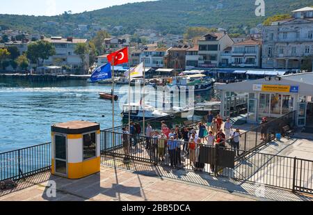 Burgazada,Turkey-September 18th 2019.Tourists wait in Burgazada behind the closed gates to board the ferry from Buyukada to Moda in Kadikoy, Istanbul Stock Photo