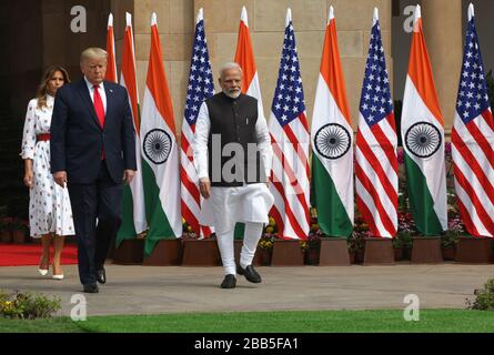 U.S. President Donald Trump, first lady Melania Trump and Indian Prime Minister Narendra Modi stand before their meeting at Hyderabad House, Tuesday,
