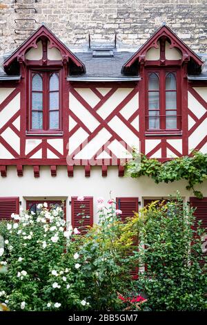 Half-Timbered home on the grounds of Église Protestante Luthérienne Saint-Jean, Paris, Ile-de-France, France Stock Photo