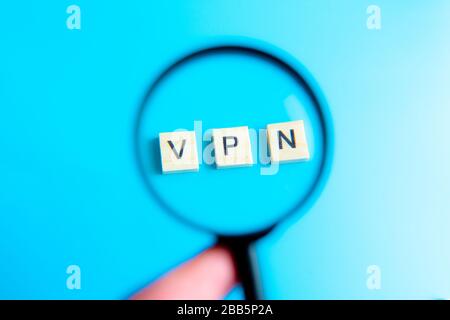 Words cloud over black background with focus on the accronym vpn witten in orange letters and a magnifying glass. Virtual Private Network concept. 3D Stock Photo