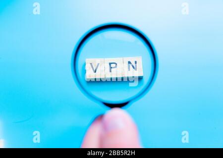 Words cloud over black background with focus on the accronym vpn witten in orange letters and a magnifying glass. Virtual Private Network concept. 3D Stock Photo