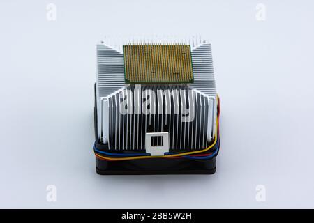 Central Processing Unit (CPU) on aluminium cooling fan on white background. Stock Photo