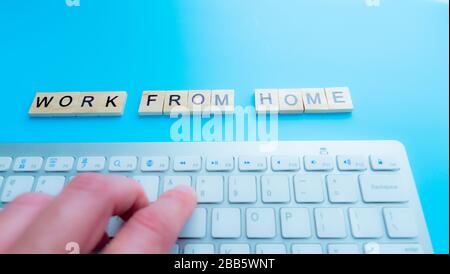 Work From Home, message concept written post it on laptop keyboard. Stock Photo