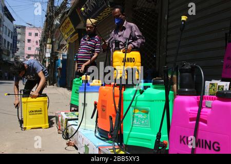 Dhaka, Bangladesh. 30th Mar, 2020. A vendor sales disinfectant sprayers on the street while wearing a mask amid concerns about the spread of coronavirus pandemic.Bangladesh has confirmed 49 cases, with 5 deaths due to corona virus (COVID-19), According to the IEDCR officials. Credit: SOPA Images Limited/Alamy Live News Stock Photo