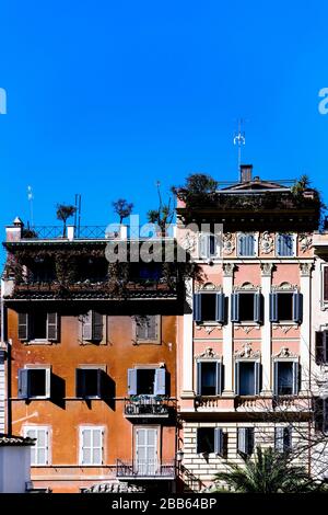 Typical roman houses with terrace and balcony with plants. Rome, Italy Stock Photo