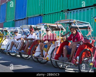 dh Local Becak taxi drivers AMBON MALUKU INDONESIA Waiting driver in queue for passengers rickshaw indonesian transport city tricycle people pedicab Stock Photo