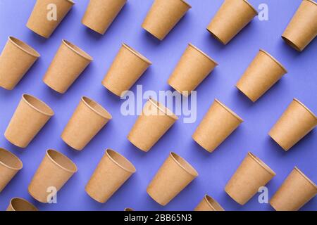 Rejection of plastic. Paper cups on purple background Stock Photo