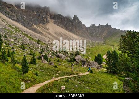 Couple hiking along the Latemar nature trail, South Tyrol, Italy Stock Photo